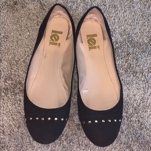 Black flats with gold detail